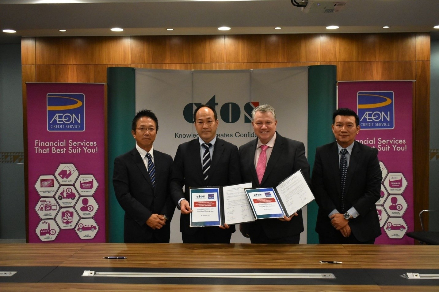 (From left) Aeon Credit chief marketing officer Shiro Ishida, managing director Yuro Kisaka, group CEO of CTOS Dennis Martin and CEO of CTOS Data Systems Sdn Bhd Group Eric Chin signed and witnessed the agreement to implement the CTOS eKYC solution.